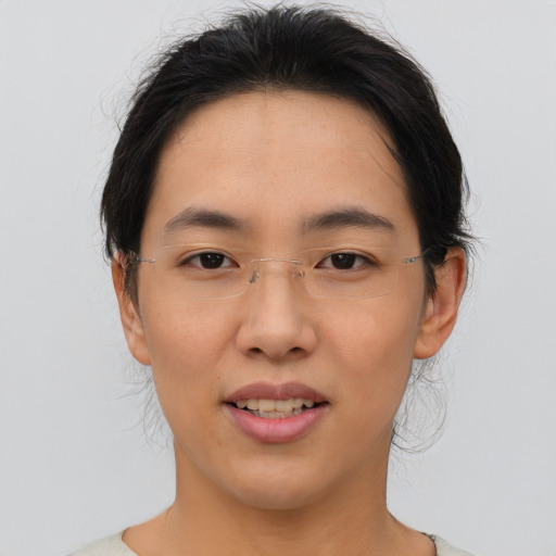 Joyful asian young-adult female with medium  brown hair and brown eyes