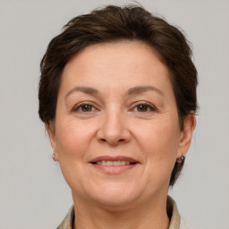 Joyful white adult female with short  brown hair and grey eyes