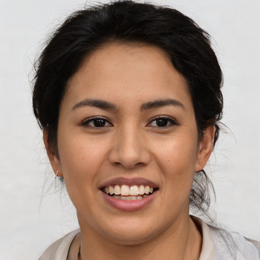 Joyful asian young-adult female with medium  brown hair and brown eyes