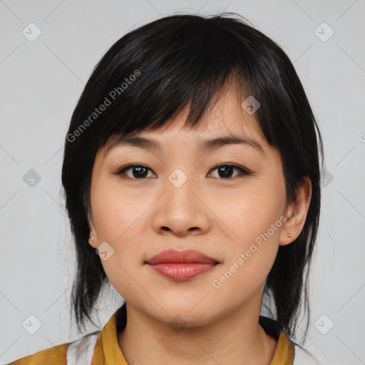 Joyful asian young-adult female with medium  black hair and brown eyes