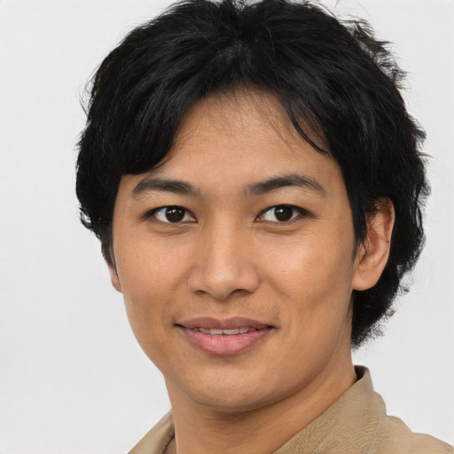 Joyful asian young-adult female with short  black hair and brown eyes