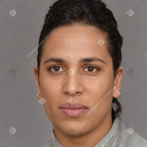 Joyful latino young-adult male with short  brown hair and brown eyes