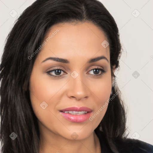 Joyful latino young-adult female with long  brown hair and brown eyes