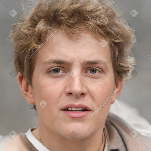 Joyful white adult male with short  brown hair and grey eyes