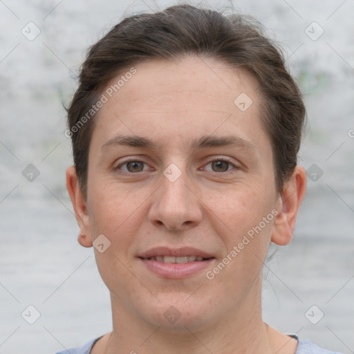 Joyful white young-adult female with short  brown hair and grey eyes