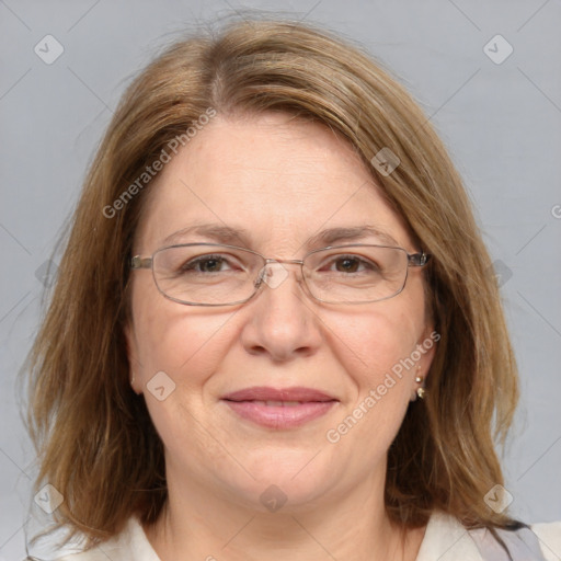 Joyful white adult female with medium  brown hair and blue eyes