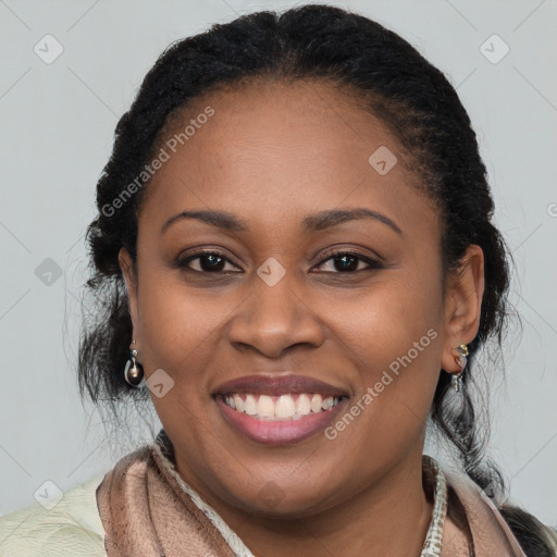 Joyful black young-adult female with long  brown hair and brown eyes