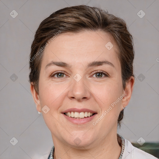 Joyful white adult female with short  brown hair and brown eyes