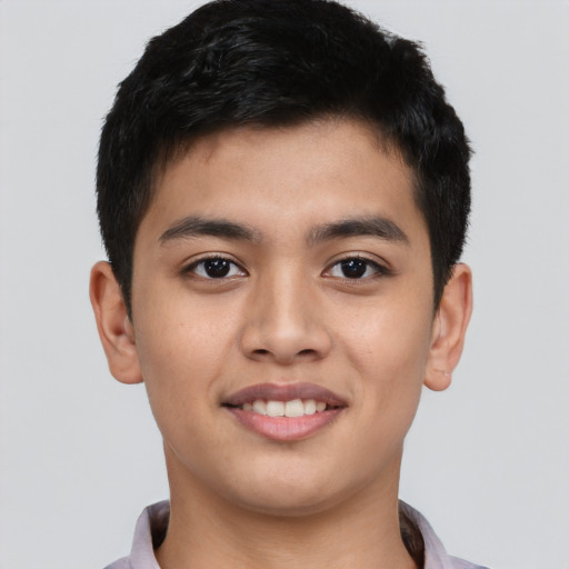 Joyful asian young-adult male with short  brown hair and brown eyes