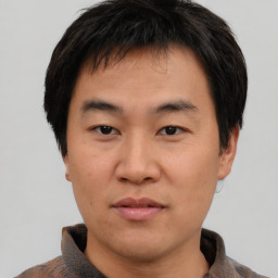 Neutral asian young-adult male with short  brown hair and brown eyes