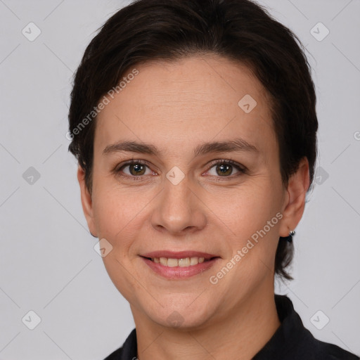 Joyful white adult female with short  brown hair and brown eyes