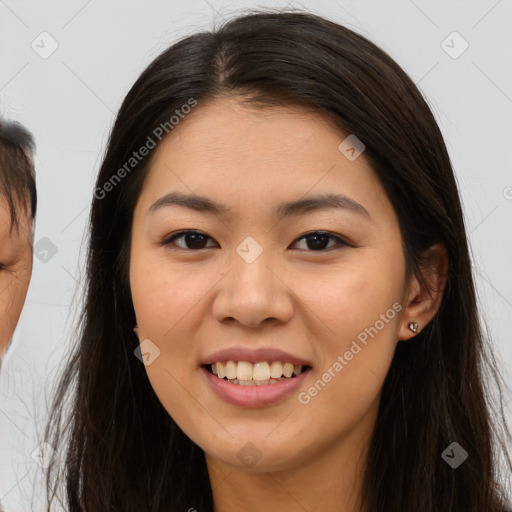 Joyful asian young-adult female with long  brown hair and brown eyes