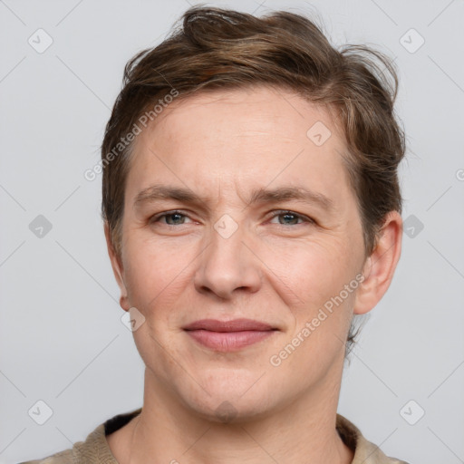 Joyful white adult male with short  brown hair and grey eyes