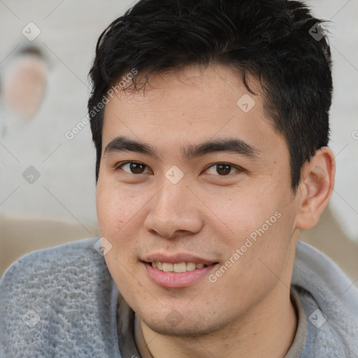 Joyful latino young-adult male with short  brown hair and brown eyes