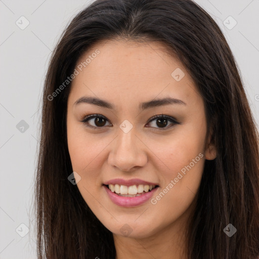 Joyful asian young-adult female with long  brown hair and brown eyes