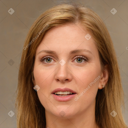 Joyful white adult female with long  brown hair and green eyes