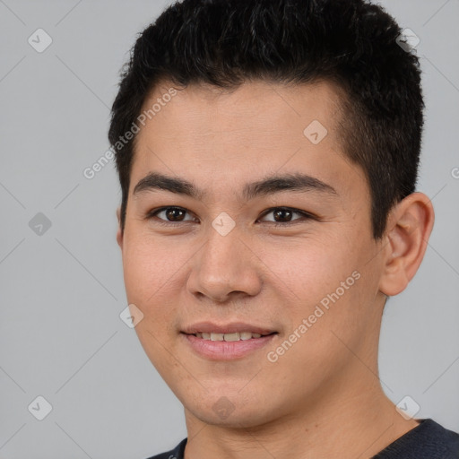 Joyful latino young-adult male with short  brown hair and brown eyes