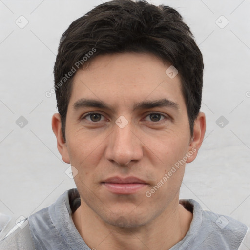 Joyful white young-adult male with short  black hair and brown eyes