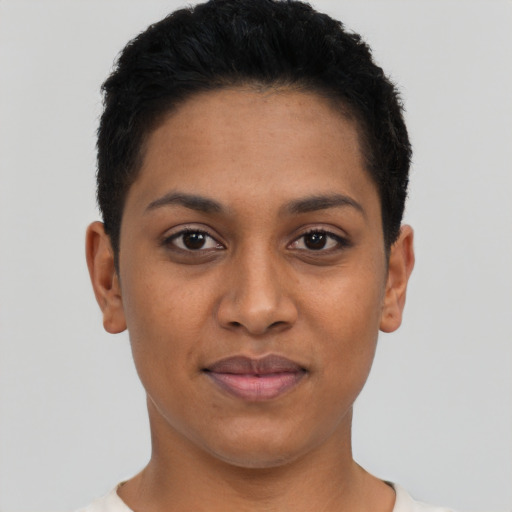 Joyful latino young-adult female with short  black hair and brown eyes