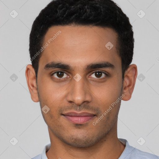 Joyful latino young-adult male with short  brown hair and brown eyes