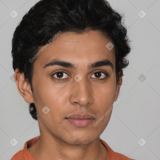 Neutral latino young-adult male with short  brown hair and brown eyes