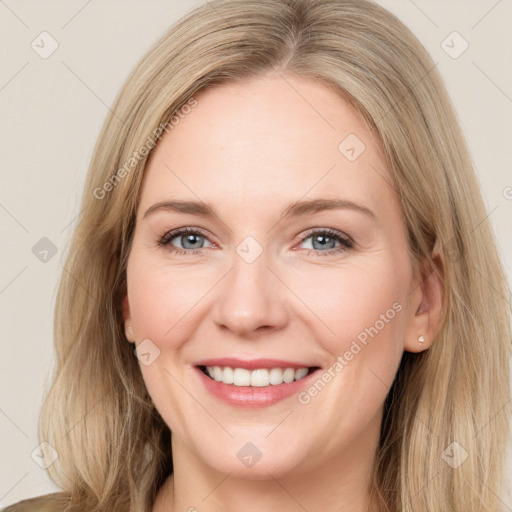 Joyful white young-adult female with long  brown hair and green eyes