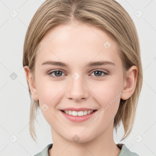 Joyful white young-adult female with medium  brown hair and grey eyes