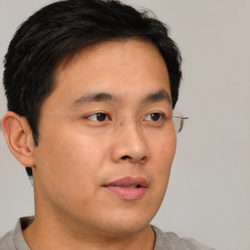 Neutral asian young-adult male with short  brown hair and brown eyes