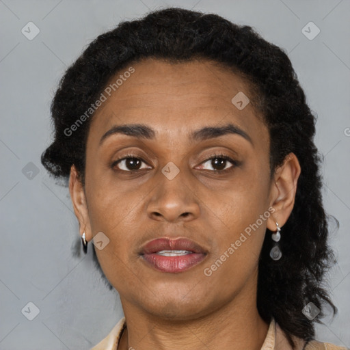 Joyful black adult female with short  brown hair and brown eyes