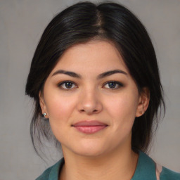Joyful asian young-adult female with medium  brown hair and brown eyes