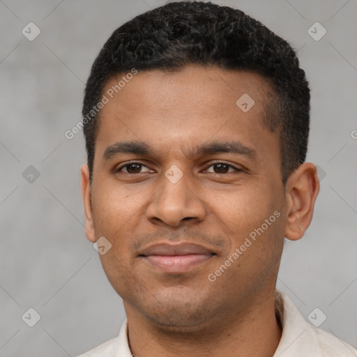 Joyful latino young-adult male with short  black hair and brown eyes