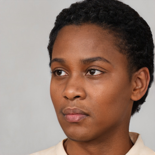 Neutral black young-adult female with short  black hair and brown eyes