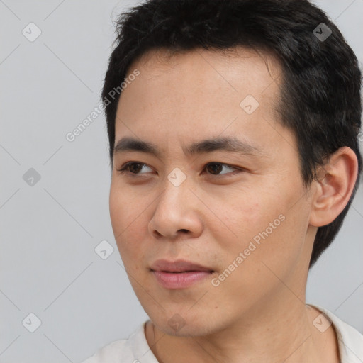 Neutral white young-adult male with short  black hair and brown eyes