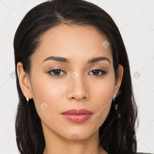 Joyful latino young-adult female with long  brown hair and brown eyes