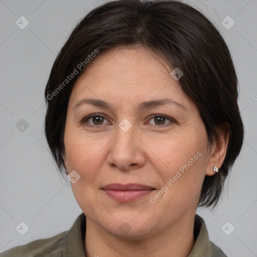 Joyful white adult female with medium  brown hair and brown eyes