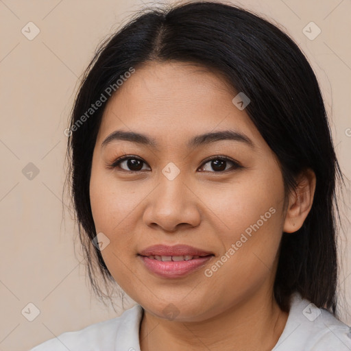 Joyful latino young-adult female with medium  brown hair and brown eyes