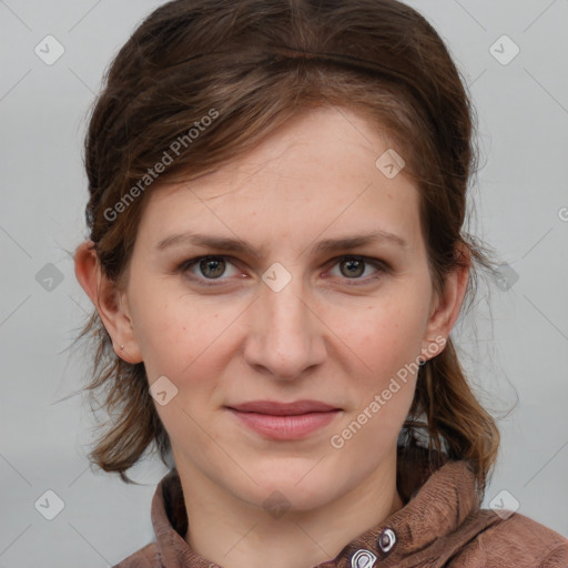 Joyful white young-adult female with medium  brown hair and blue eyes