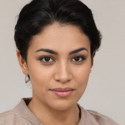 Joyful latino young-adult female with medium  brown hair and brown eyes