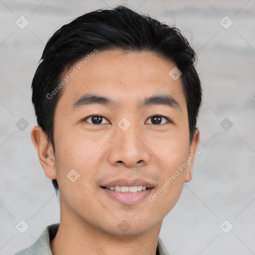 Joyful asian young-adult male with short  brown hair and brown eyes