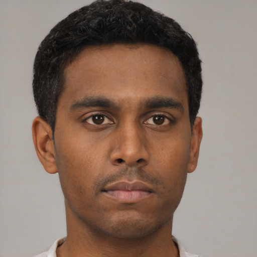 Neutral black young-adult male with short  black hair and brown eyes