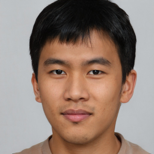 Neutral asian young-adult male with short  brown hair and brown eyes