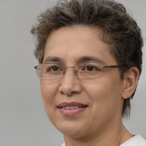 Joyful white adult female with short  brown hair and brown eyes