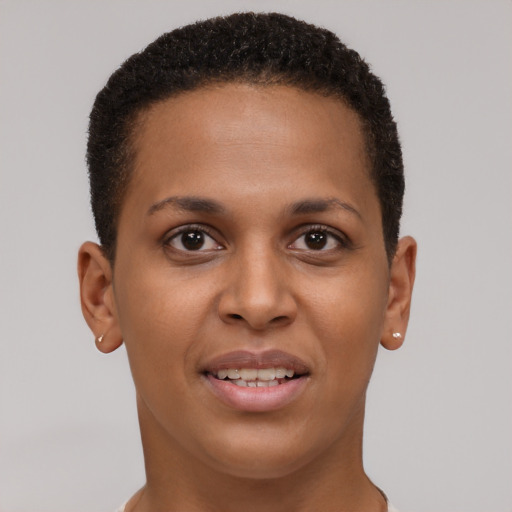 Joyful black young-adult female with short  brown hair and brown eyes