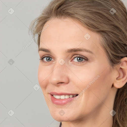 Joyful white young-adult female with medium  brown hair and blue eyes