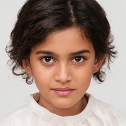 Joyful white child female with medium  brown hair and brown eyes