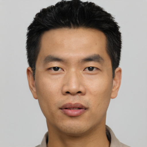 Neutral asian young-adult male with short  black hair and brown eyes
