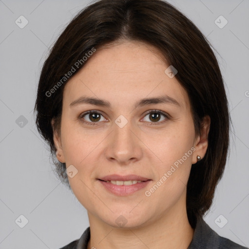 Joyful white adult female with medium  brown hair and brown eyes