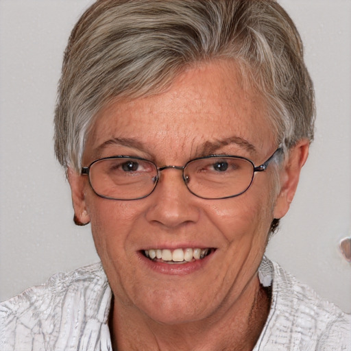 Joyful white middle-aged female with short  brown hair and blue eyes