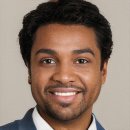 Joyful black young-adult male with short  black hair and brown eyes