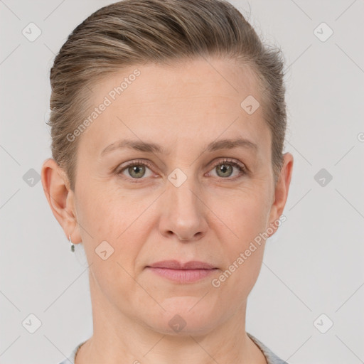 Joyful white adult female with short  brown hair and grey eyes